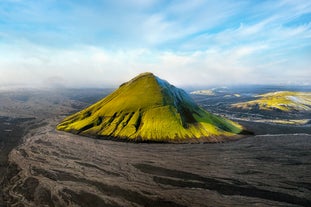 Maelifell mountain is easily recognizable with its green slopes and cone shape.