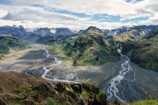 Scenic mountains, glacial rivers, and rich vegetation define the Thorsmork Nature Reserve in Iceland.