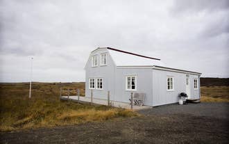 Lambalækur Guesthouse has a traditional facade.