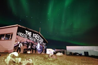 The Freezer Hostel, beneath the Northern Lights in Iceland.