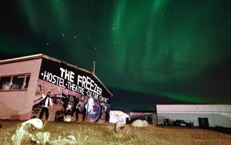 The Freezer Hostel, beneath the Northern Lights in Iceland.