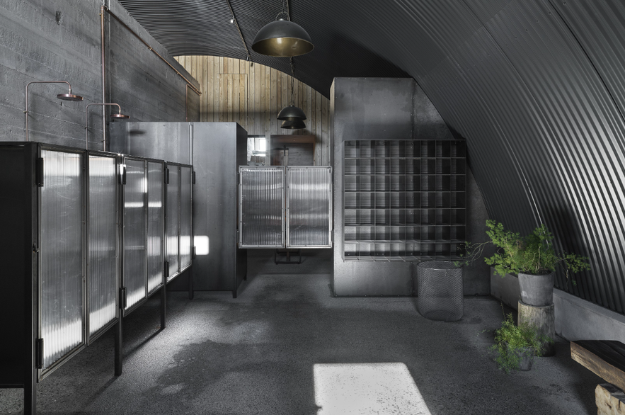 Modern Icelandic public pool changing area in Reykjavik, showing local customs and etiquette for how to travel in Iceland.