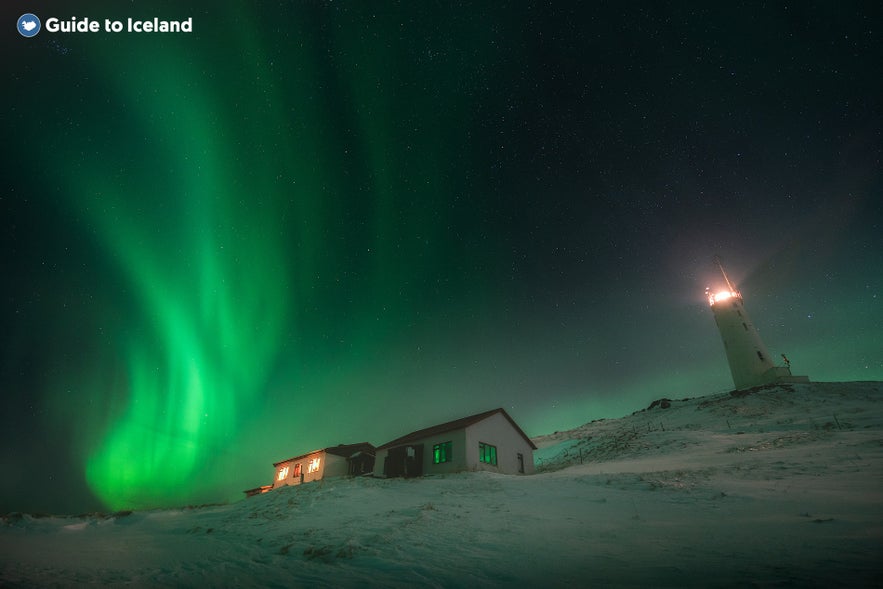 Swirling auroras around a Reykjanes lighthouse