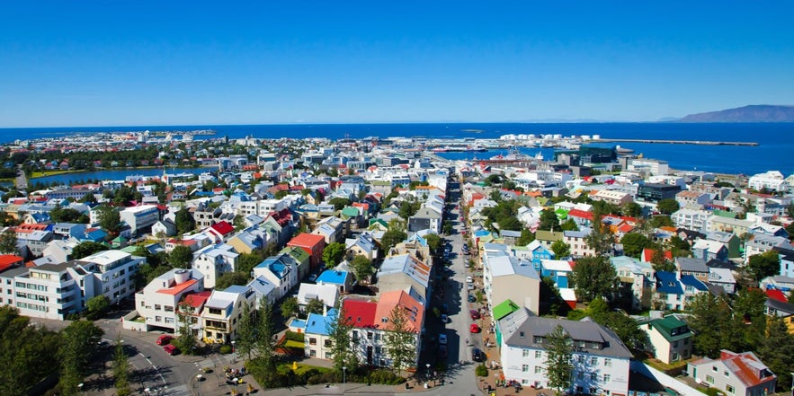 Colorful rooftops of Reykjavik city center with ocean views, ideal for where to stay in Reykjavik.