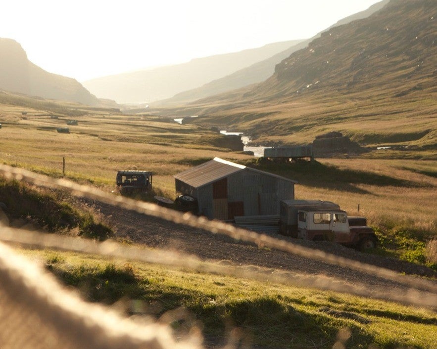 Remote valley farmhouses in Iceland surrounded by mountains and rivers, a unique place to stay in Iceland.