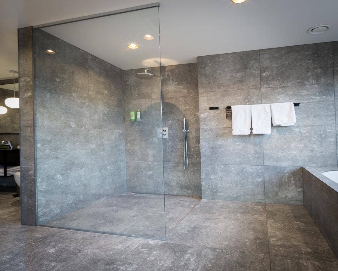A large walk-in shower in one of the bathrooms at the Fosshotel Glacier Lagoon.