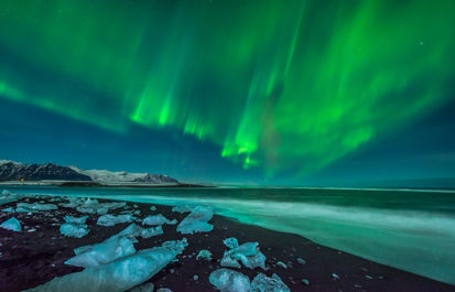 The northern lights dancing above Jokulsarlon glacier lagoon.