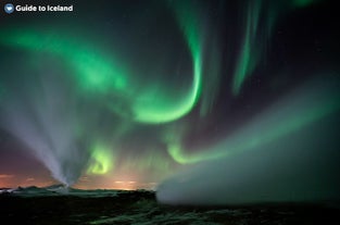 The northern lights showcase a stunning display of green, pink, red, yellow, purple in different shades.