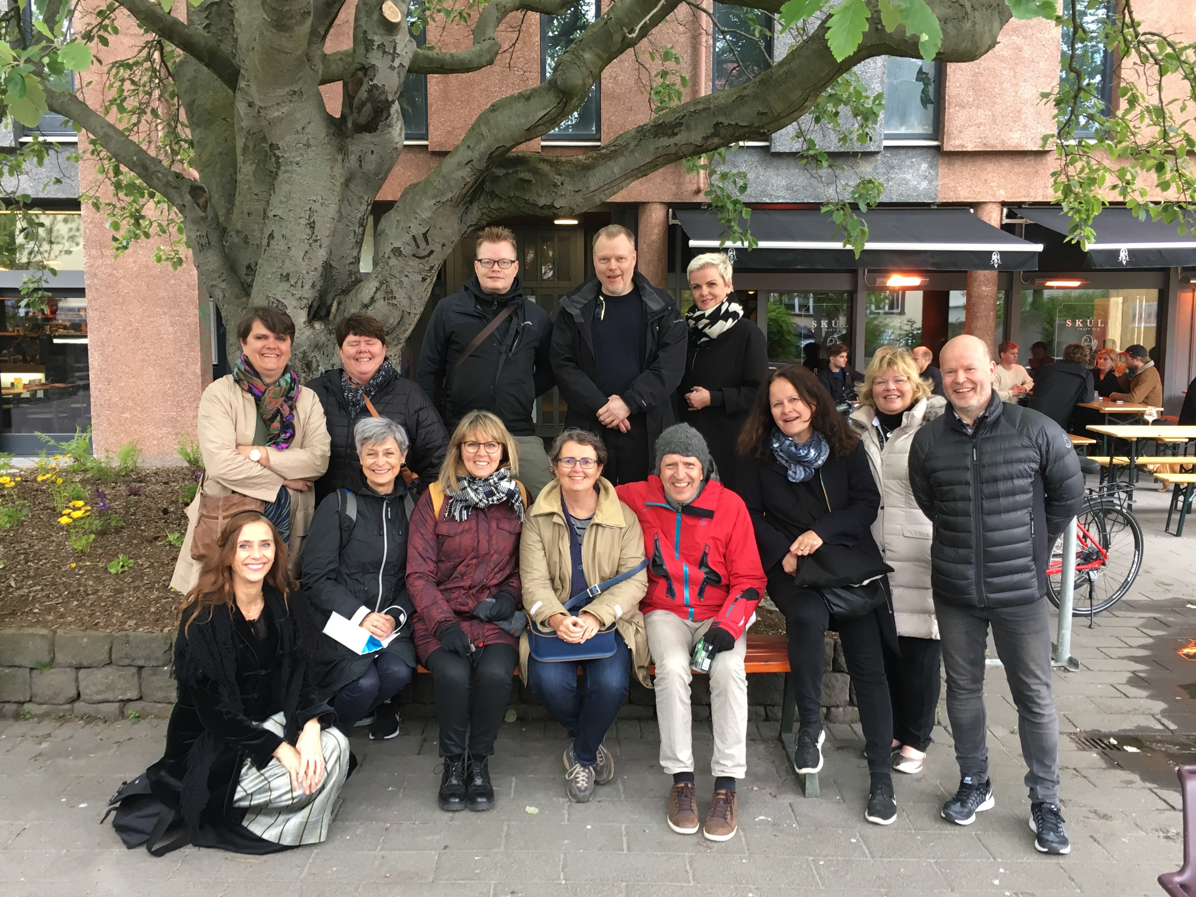 Tour joiners taking a group photo while exploring Reykjavik.