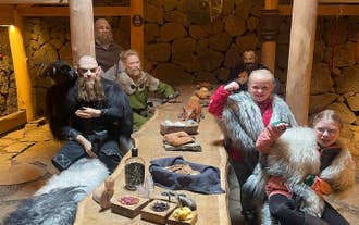 Guests posing with some Vikings at the Herjolfstown Museum.