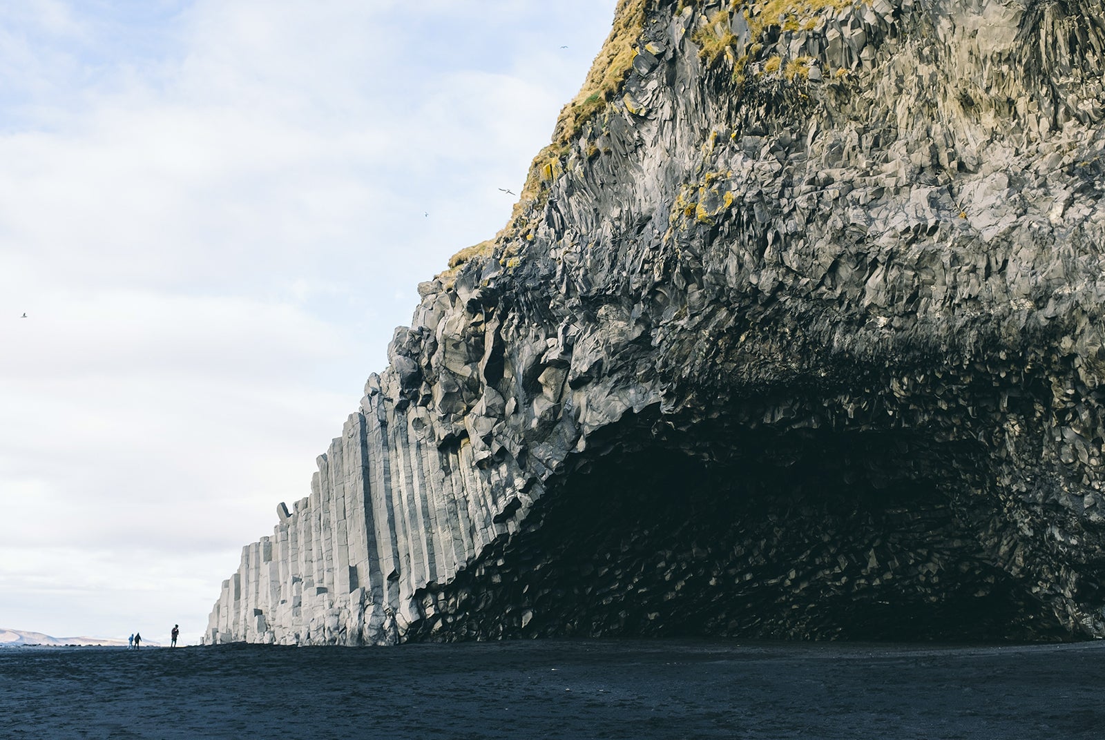 Basalt columns line the coast of Reynisfjara Black Sand Beach in the South Coast.