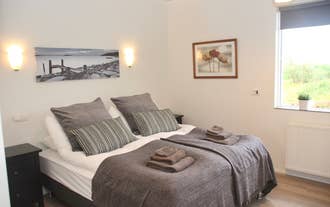 The main bedroom in Lynghagi features a comfortable double bed.