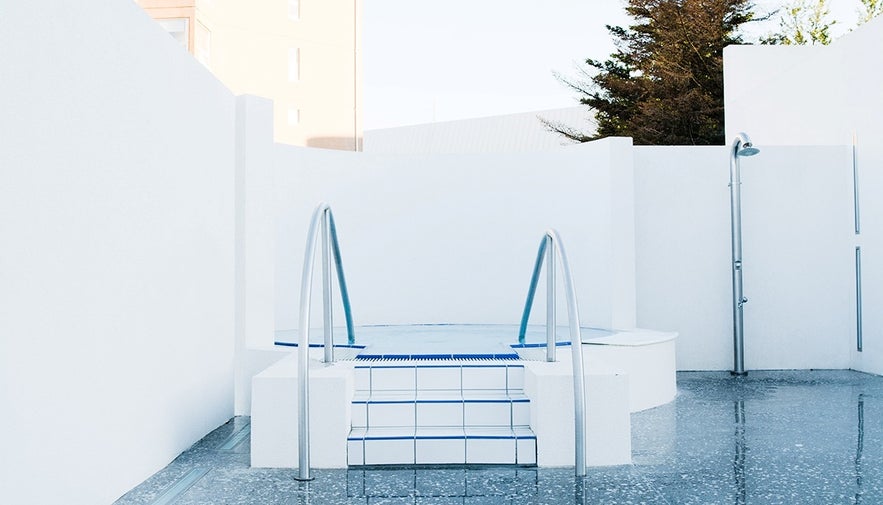 Cold plunge pool at Sundhollin, a striking white feature often found alongside hot tubs at top swimming pools in Reykjavik.