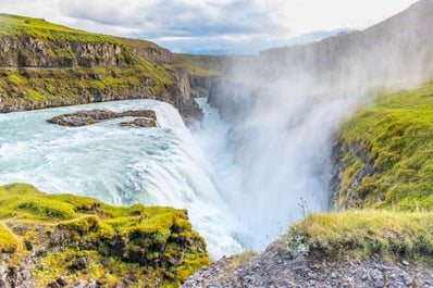 The beautiful Gullfoss waterfall cascades with force into a deep canyon.