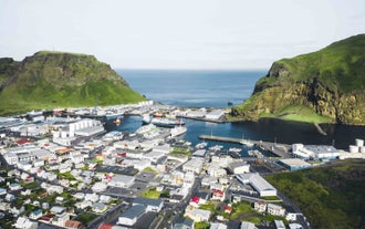 An aerial view of a small town in Vestmannaeyjar.