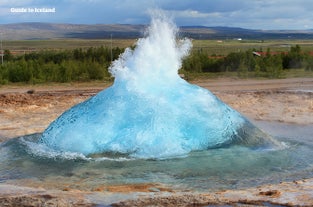 The Strokkur geyser erupts in the Geysir geothermal area on the Golden Circle route in Iceland.