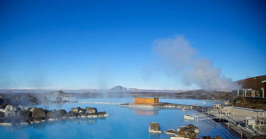 Panoramic view of Earth Lagoon in North Iceland with steaming geothermal waters and scenic volcanic landscapes.