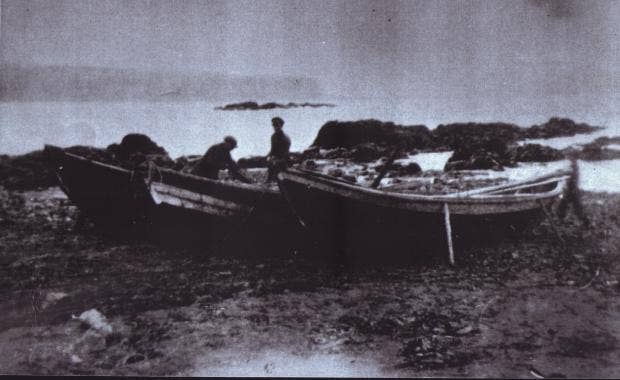 Old black-and-white photo of Icelandic fishermen with rowboats on shore; a blurry figure on the right is believed to be a "móri," a male ghost from Icelandic folklore. Old black-and-white photo of Icelandic fishermen with rowboats on shore; a blurry figure on the right is believed to be a "móri," a male ghost from Icelandic folklore.