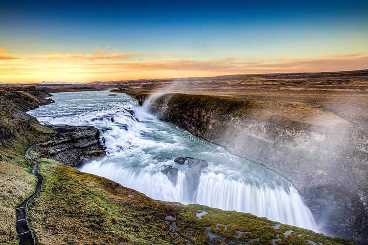 The Golden Circle's Gullfoss waterfall roars with a two-tier flow.