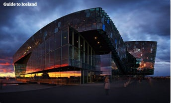 The Harpa Concert Hall features a shimmering glass facade.