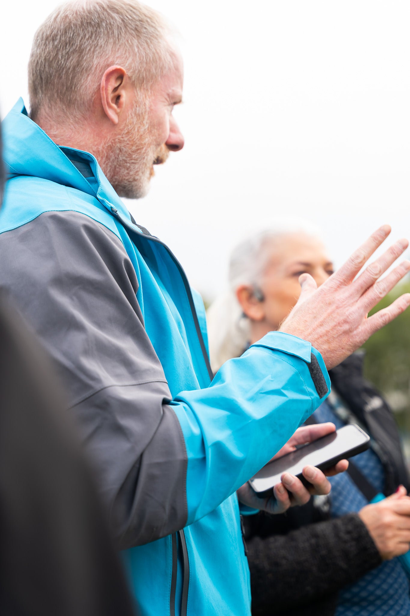 A friendly game host explains the rules to participants.
