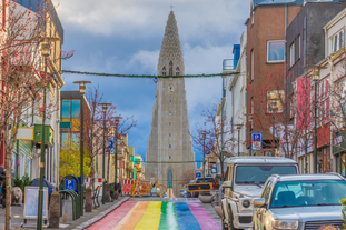 The Rainbow Street leads to the iconic Hallgrimskirkja church.