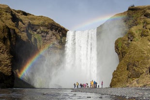 A sunny day and the mist of Skogafoss waterfall often creates rainbows.
