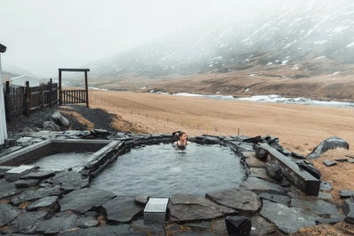 A woman enjoys soaking in the beautiful pools at the Wilderness Center.