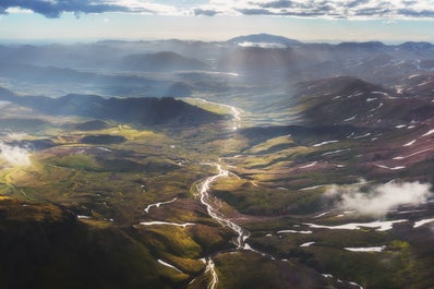 The sun shines beautifully over the mountains and valleys of Thorsmork in Iceland.