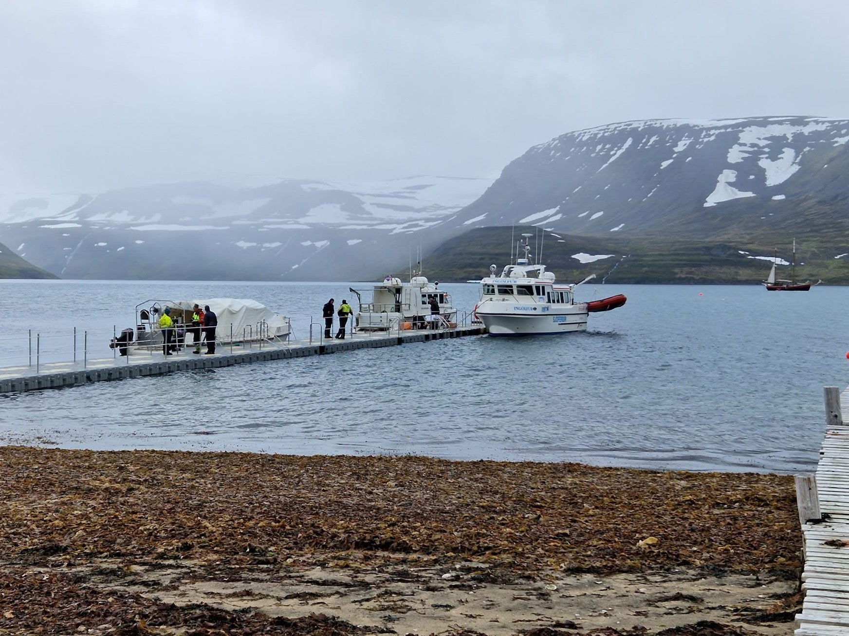 Small boats docked at the harbor of Hesteyri in Hornstrandir.
