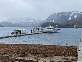 Small boats docked at the harbor of Hesteyri in Hornstrandir.