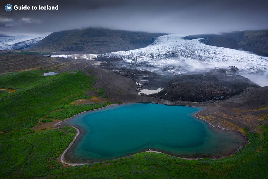 Aerial view of Skaftafellsjokull Glacier and a turquoise glacial lake in Vatnajokull National Park, Iceland.