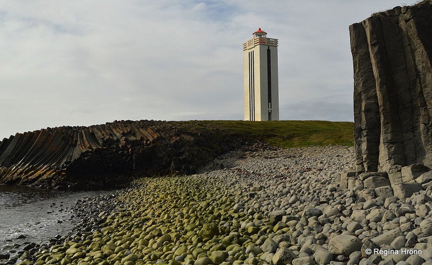 Kálfshamarsvík beach in Iceland has basalt columns and a lighthouse.