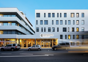 Miðgarður by Center Hotels has a clean white exterior.