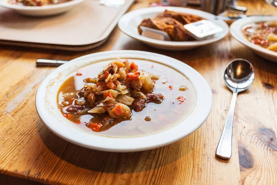 Traditional Icelandic lamb meat soup served in a bowl with bread