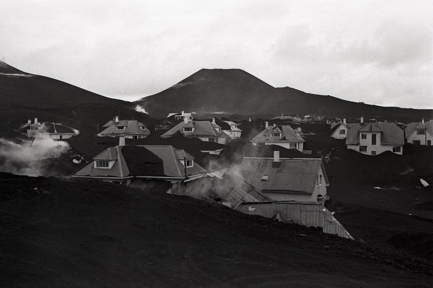 The island of Heimaey, mid-eruption.