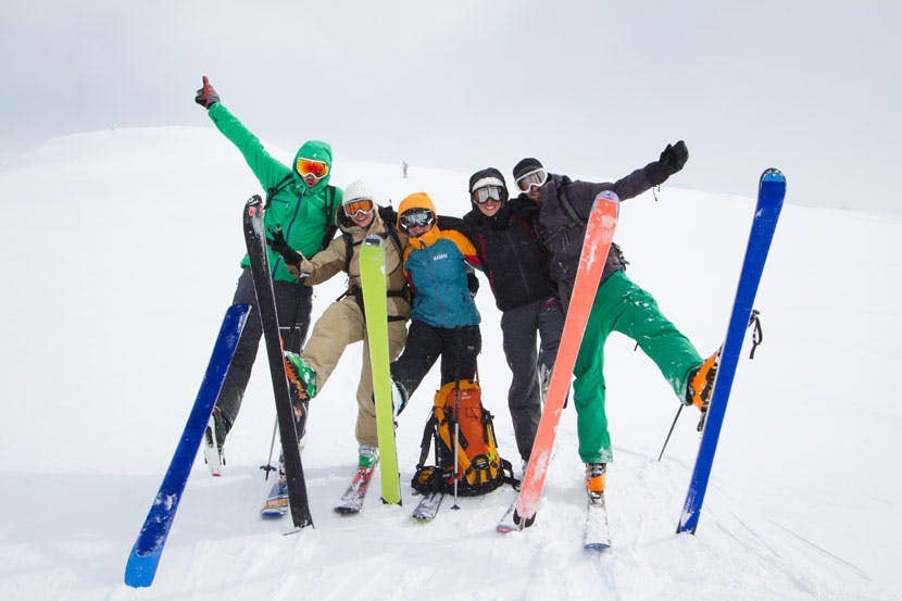 Skiing and snowboarding in Iceland with friends enjoying a winter adventure on snowy mountain slopes.