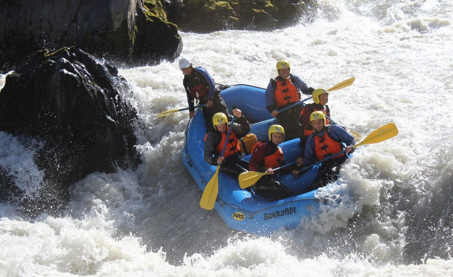 A river nearly flips a boat of rafters in Iceland.