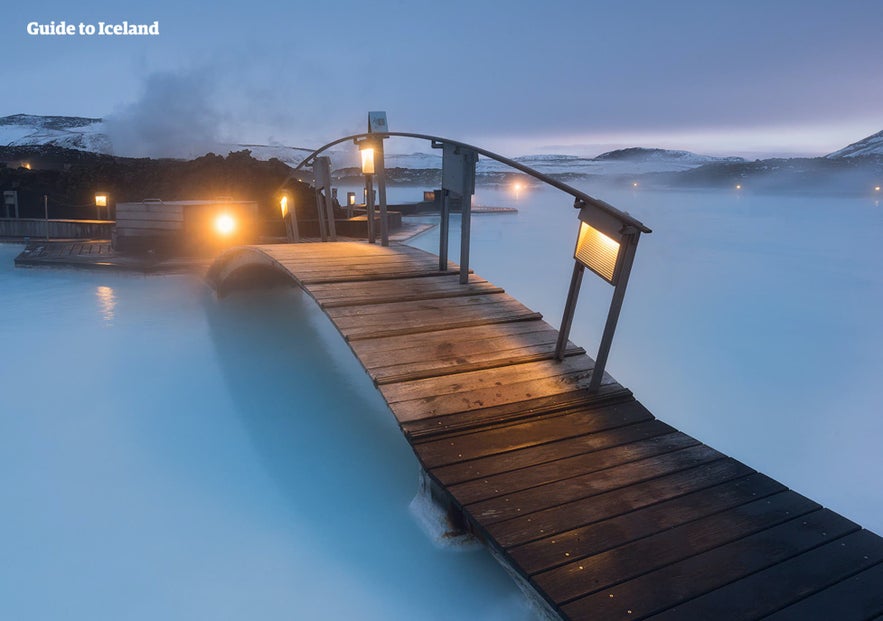 A bridge crosses the azure waters of the Blue Lagoon.