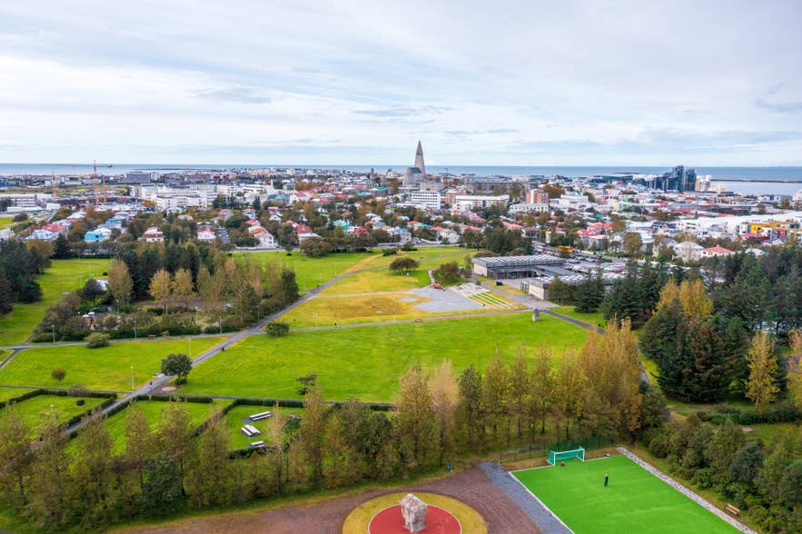 An aerial view of Klambratun Park with buildings in the distance An aerial view of Klambratun Park with buildings in the distance