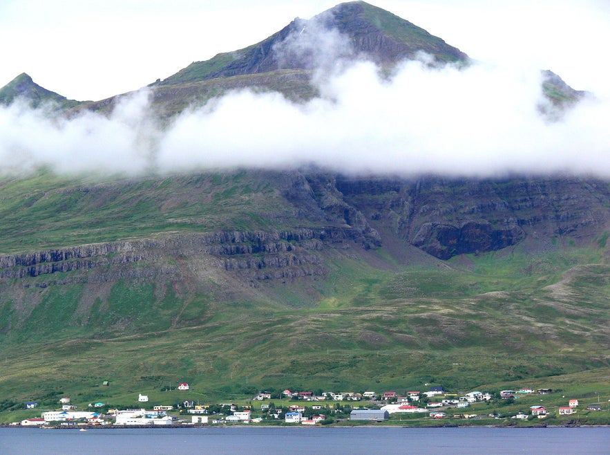 Stöðvarfjördur sits beneath a cloud in East Iceland.