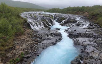 Turquoise waters of Bruarfoss Waterfall in the Golden Circle.