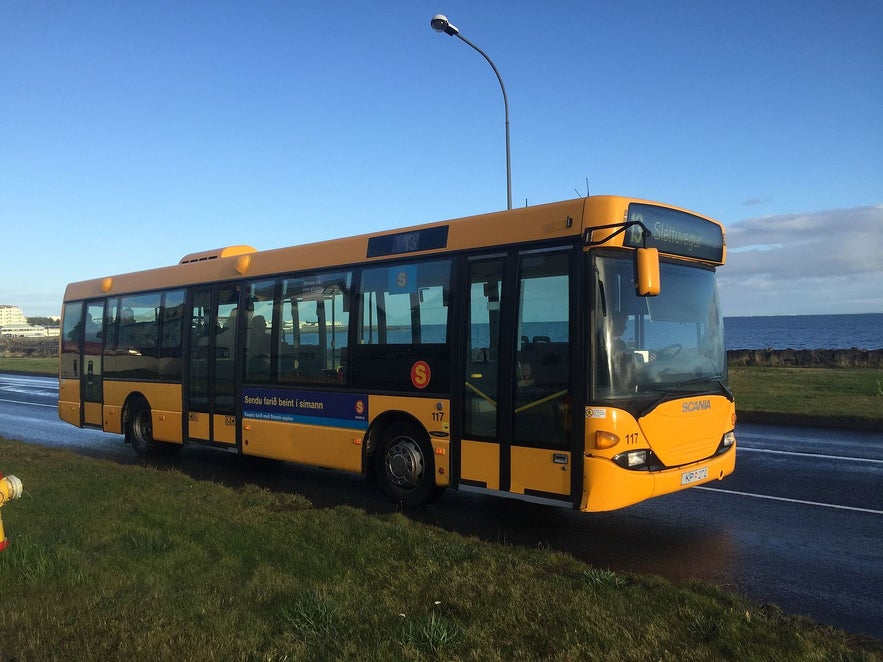 A bus pulls up on Saebraut in Iceland.