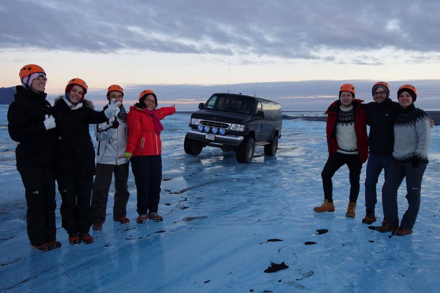 A group disembark from a super jeep.