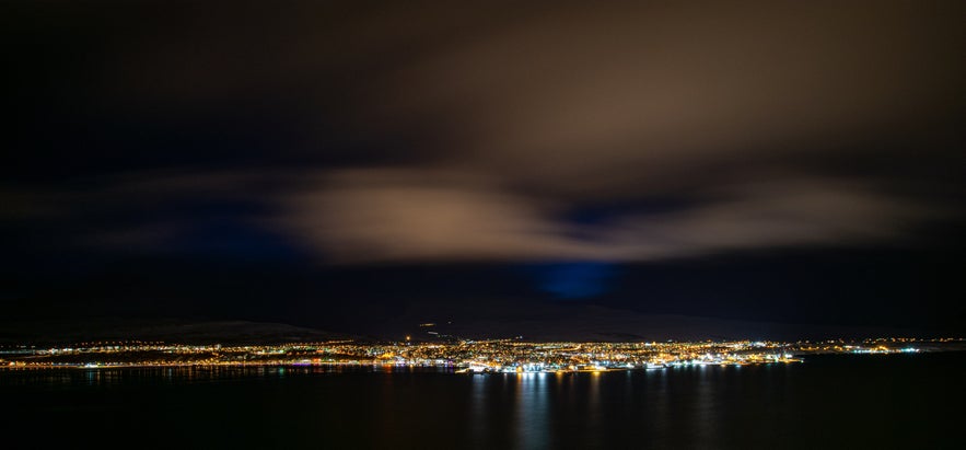 Akureyri by night, from the ocean.