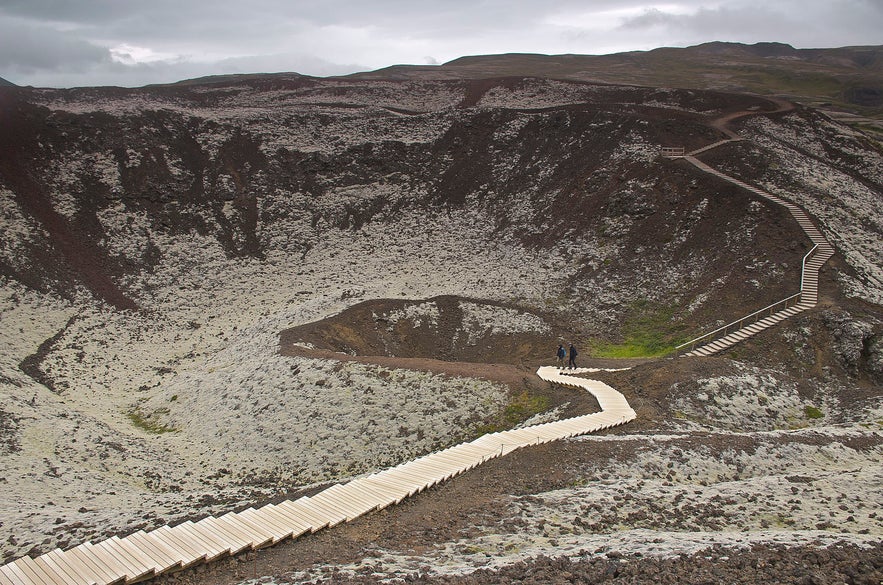 Hikers first venture up the crater's hill sides, before either circling its centre or venturing down to the bottom.