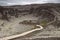 Hikers first venture up the crater's hill sides, before either circling its centre or venturing down to the bottom.