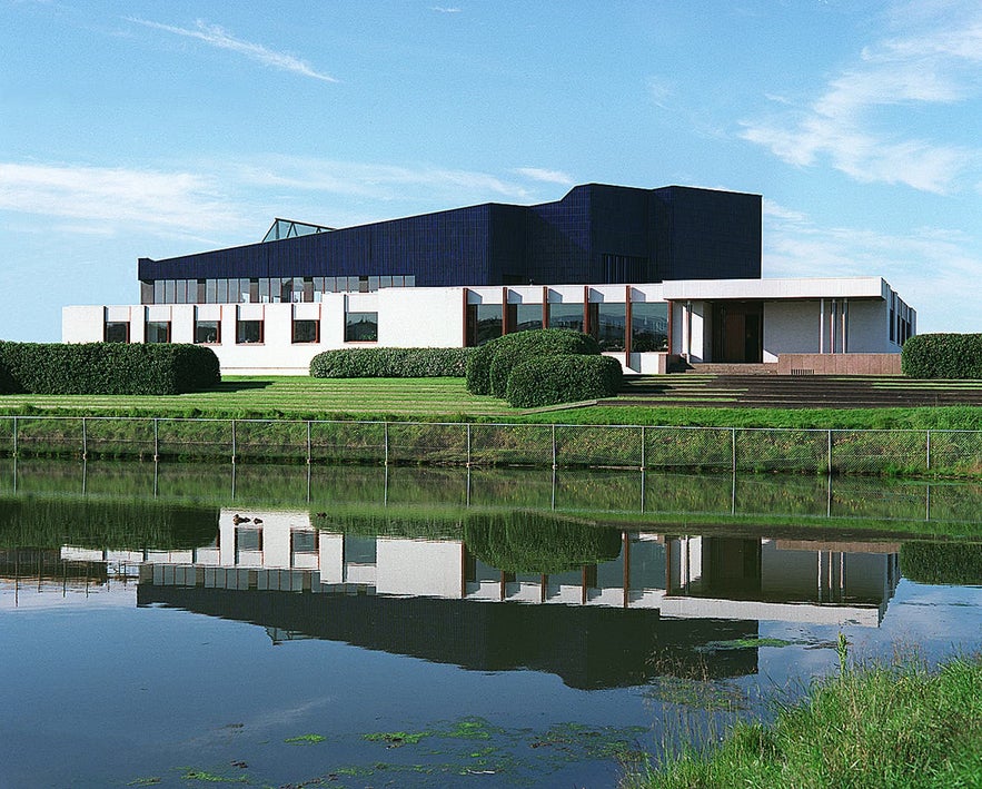 The Nordic House's curved blue roof is made to resemble the mountainous backdrop.