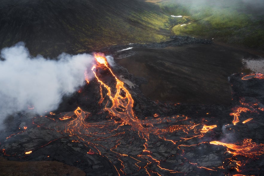 A river of lava flows from a crater at Fagradalsfjall volcano in Iceland.