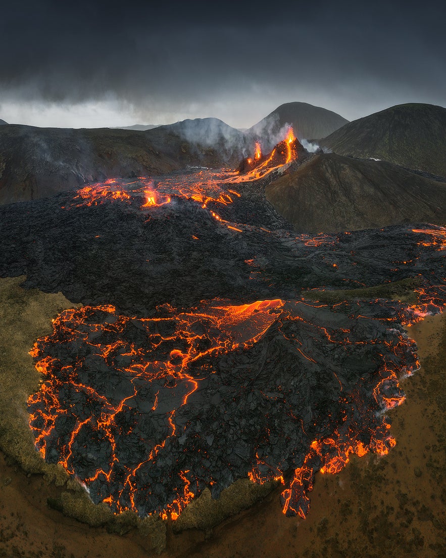 Two jets of fire rise over the lava landscapes of the erupting Fagradalsfjall.